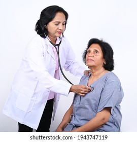 Indian female doctor and patient during health checkup - Shutterstock ID 1943747119