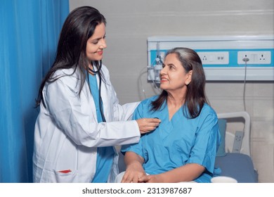 Indian female doctor using a stethoscope for check up on bed at hospital. - Powered by Shutterstock