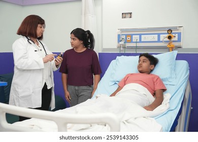 Indian female pediatrician doctor prescribed medicine to child in hospital, bed or clinic with medical results. Sick, kid and conversation with pediatrician to check patient or help with advice - Powered by Shutterstock