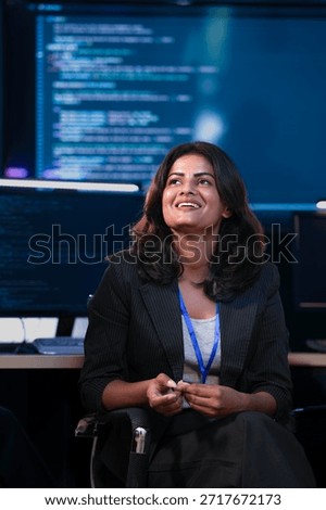 An Indian female software engineer or data scientist smiles during a technical briefing in a command center SOC. She is in a meeting analyzing AI code or cybersecurity data at night.