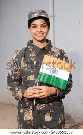 Indian Female soldier holding Indian flag in village