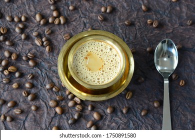 Indian Filter Coffee served in brass cup and saucer