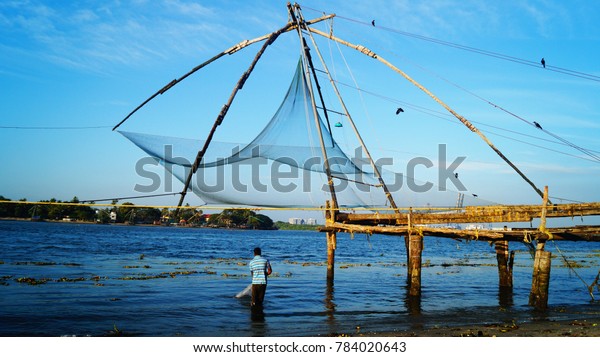 Indian Fisherman Catch Fish By Throwing Stock Photo Edit Now