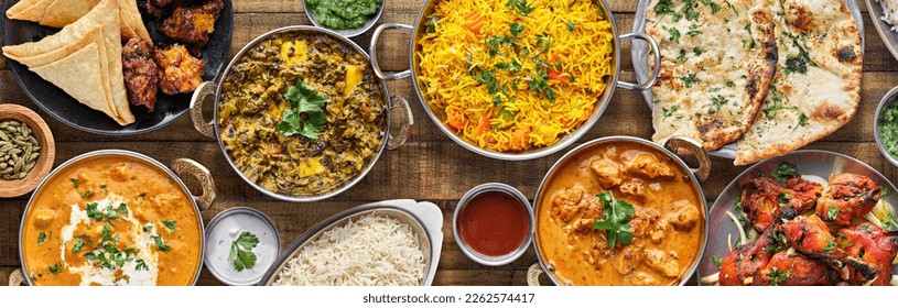 indian food feast with chicken tikka masala curry, tandoori chicken and appetizers - Powered by Shutterstock