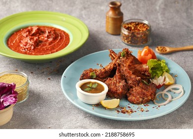 Indian Food . Grilled Lamb Ribs - Lamb Chops And Tandoori Chicken Curry On Graphite Background