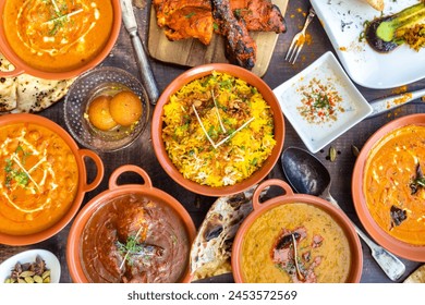 Indian food: Rich and diverse, comprising a wide array of regional dishes and flavors, often characterized by aromatic spices, vibrant colors, and complex flavors, such as curries, biryanis, and tando - Powered by Shutterstock