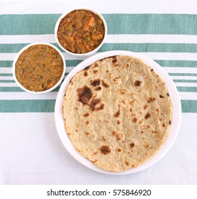 Indian Food Roti, A Traditional And Popular Bread Made From Wheat Flour Dough, And Two Vegetable Curries As Side Dishes.