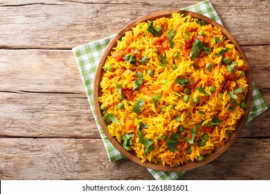 Indian food Tawa Pulao rice with vegetables and spices close-up on a plate. horizontal top view from above
 - Powered by Shutterstock