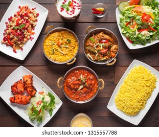 Indian Food, Top Down View - Delicious Mixed Oriental Dishes, Beautifully Arranged And Surved On A Wooden Table	
