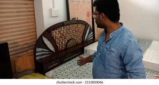 An Indian Furniture Shopkeeper Showing Double Bed Into The Showroom At District Katni Madhya Pradesh In India Shot Captured On Sep 2019