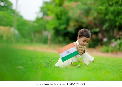 indian girl child holding indian flag