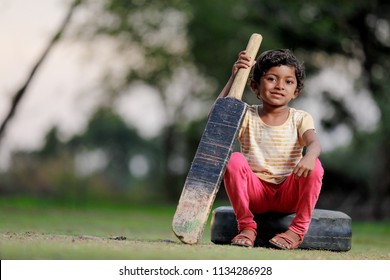 Indian Girl Child Playing Cricket