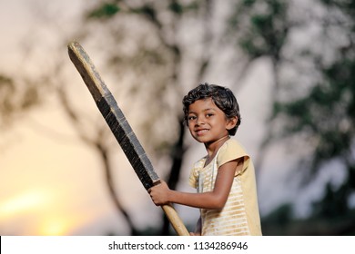 indian girl child playing cricket