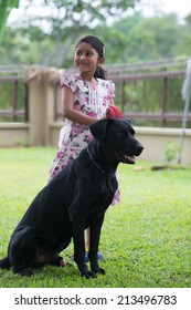 Indian Girl With Family Dog Outdoor