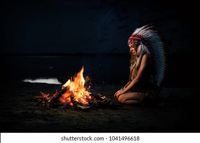 
indian girl at night near the fire.