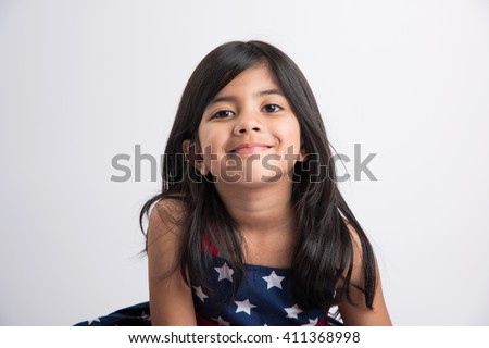 Indian girl posing for photo shoot with joyful and different expressions, isolated over white background