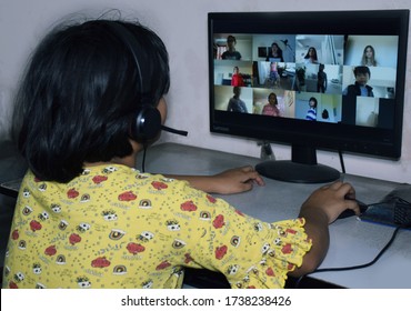 
An Indian Girl Studying Online Using Her Desktop While Interacting With Classmates During Her Distant Class As A Result Of Covid Lock Down.
India, 22th May 2020  
