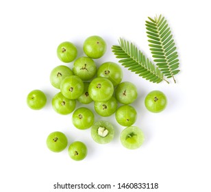 Indian gooseberry with leaf on white background. top view