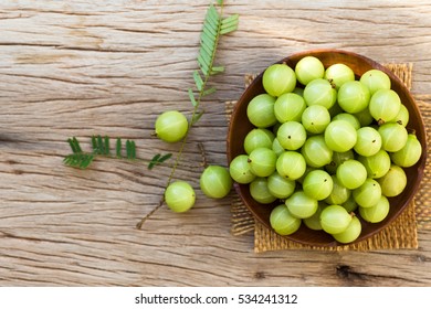 Indian Gooseberry On A Wooden Floor