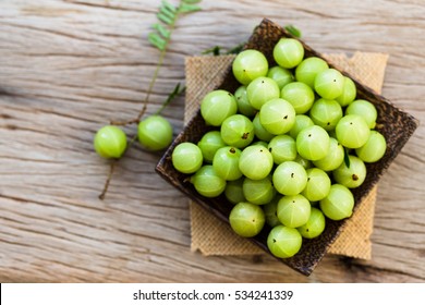 Indian gooseberry on a wooden floor