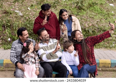 Similar – Man holding hot dog in barbecue with friends