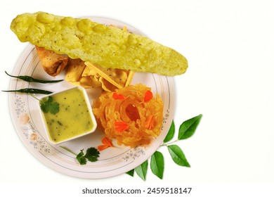 indian gujarati traditional tea time snack food fafda,fafda papdi,papadi with jalebi sweet,white background,top view,copy space