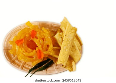indian gujarati traditional tea time snack food fafda,fafda papdi,papadi with jalebi sweet,white background,top view,copy space