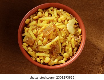 Indian Gujrathi snacks called Lilo Chevdo served in bowl isolated on dark background 