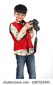 Indian handsome boy using camera.