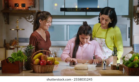 Indian happy mother with cute daughter rolling raw dough together teach baking cookies in modern kitchen house. Carefree young adult mom girl kid child learn cooking homemade bakery food indoor home - Powered by Shutterstock