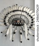 Indian headdress Western Ethnic Large feathers of various colors were tied together with cloth and animal skins strung together with colorful 