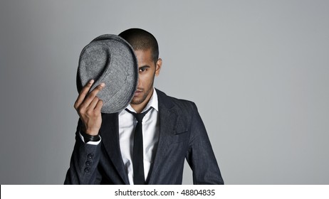 Indian High Fashion Model Covers Half His Face With A Fedora