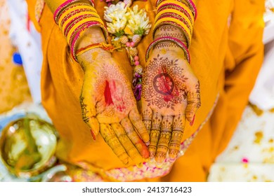 Indian Hindu pre wedding yellow turmeric Haldi ceremony hands close up - Powered by Shutterstock