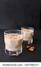 Indian Holi Or Kojagiri Festival Drink Thandai Or Masala Milk. It Is An Indian Cold Drink Prepared With A Mixture Of Milk, Dry Fruits & Sugar. Garnished With Almonds, Pistachio & Saffron. Copy Space.