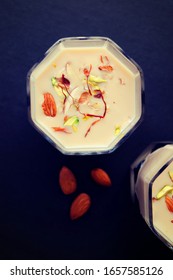 Indian Holi Or Kojagiri Festival Drink Thandai Or Masala Milk. It Is An Indian Cold Drink Prepared With A Mixture Of Milk, Dry Fruits & Sugar. Garnished With Almonds, Pistachio & Saffron. Copy Space.