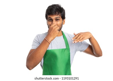 Indian Hypermarket Or Supermarket Employee Expressing Disgust With Bad Smell Gesture As Rotten Concept Isolated On White