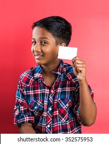 Indian Kid Holding White Card, Indian Boy And Card, Indian Kid Or Indian Boy With White Card Or Banner, Red Background, Smart Boy, Asian Boy Showing White Empty Card