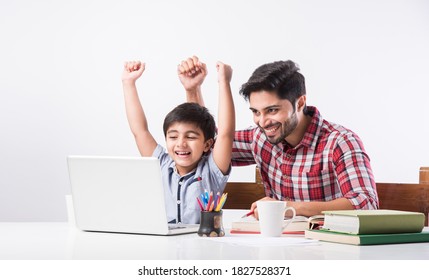 Indian kid studying online, attending school via e-learning with father