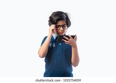 Indian Kid Using Smartphone Or Mobile Phone While Wering Glasses, With Success Or Sad Expressions