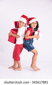 Indian Kids With Christmas Gifts, Isolated Over White Background