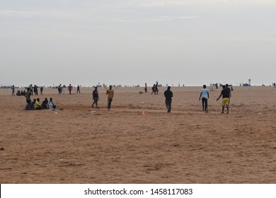 Indian Kids Playing Cricket And Running Practicing In The Beach At Marina Beach, Chennai, India. Picture Taken On 01/07/2019