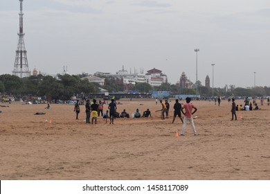 Indian Kids Playing Cricket And Running Practicing In The Beach At Marina Beach, Chennai, India. Picture Taken On 01/07/2019