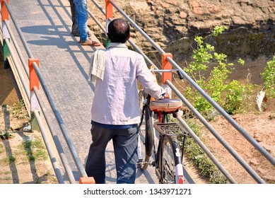An Indian labourer going to work
