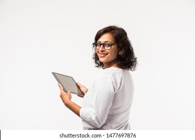 Indian Lady/women Using Tablet Pc While Standing Isolated Over White Background, Selective Focus