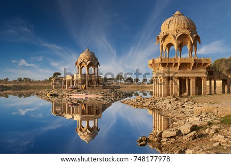Indian landmarks Gadi Sagar temple on Gadisar lake Jaisalmer, Rajasthan, north India.