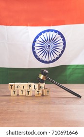 Indian Law On Triple Talaq Or Divorce Showing Tricolour, Wooden Gavel And Words Written Over Wooden Block