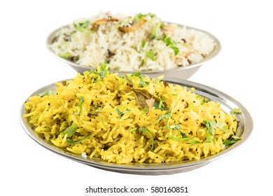 Indian lemon and mushrooms basmati rice on metal plates isolated from background