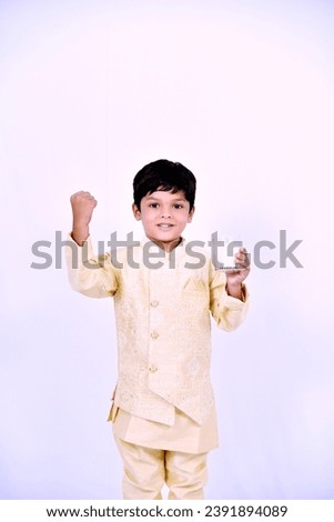 Indian little boy holding milk in hand onwhite background