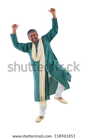 Indian male dancer performs folk dance 