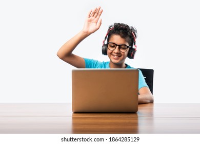 Indian Male Syudent Or Kid Studying Online Using Laptop. Asian Child Attending Online School Using Computer